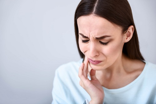 woman with toothache from cavity