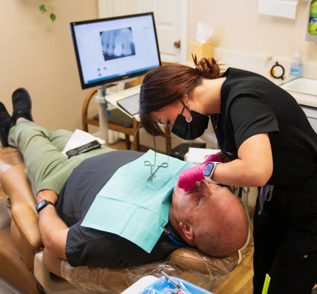 Dentist providing urgent dental care to a patient