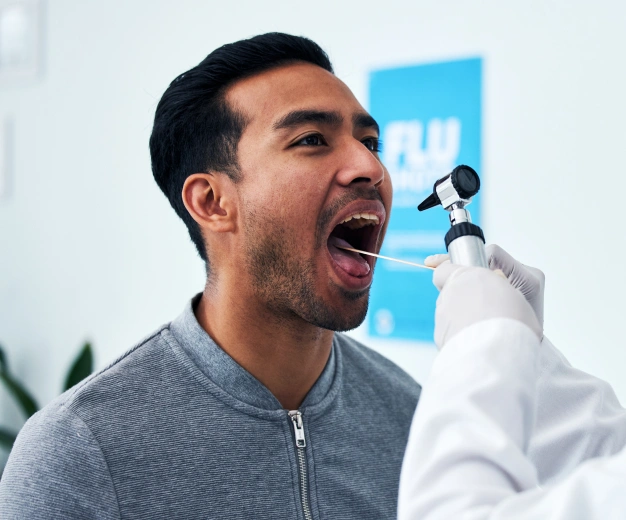 Patient receiving an oral examination during dental treatment