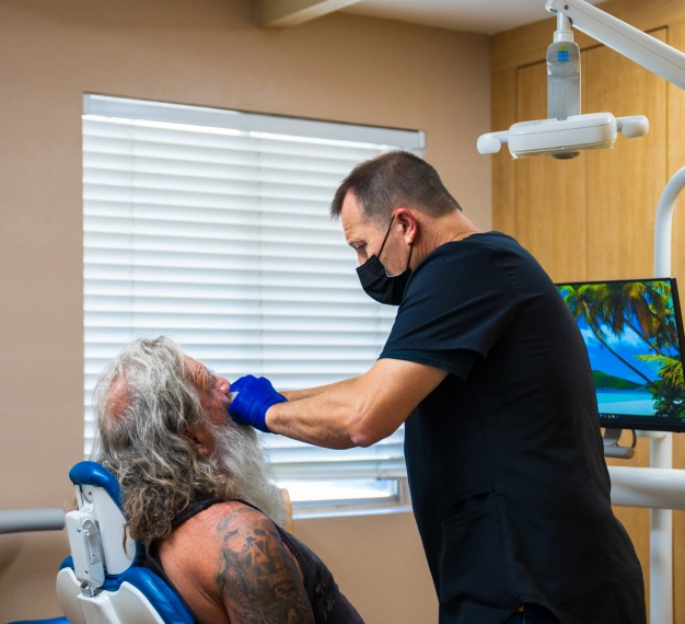 Dentist providing periodontal care to a patient