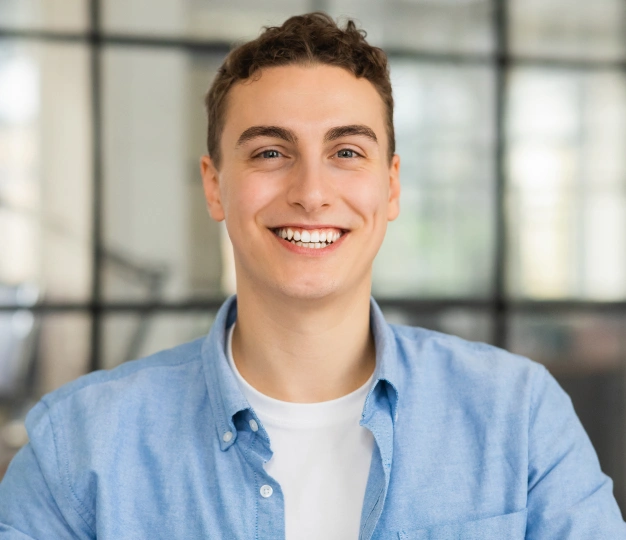 Smiling patient after restorative dental treatment